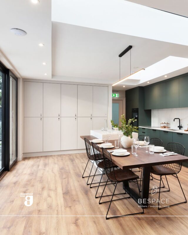 Balance bold colours with timeless craftsmanship 🤝

This open plan kitchen showcases a beautiful deep green colour, paired with a warm brown table and sleek black accents. The rich brown media wall with built-in alcoves and soft lighting adds depth, warmth and sophistication, all bespoke to the client 🙌

Visit our showrooms or book a consultation today | Link in bio